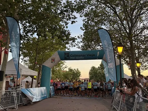 Runners at the start of the night race as evening falls